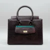 Chocolate brown crocodile-embossed genuine leather handbag with gold-tone hardware and a structured, elegant silhouette.
